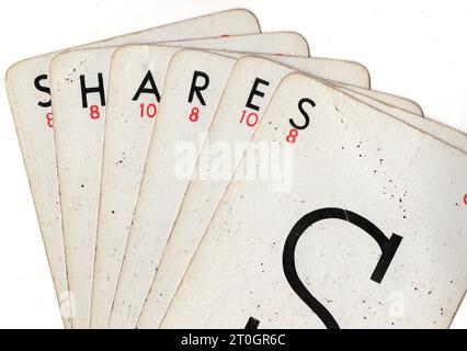 Vintage Lexicon playing cards spelling the word SHARES on a white background. Stock Photo