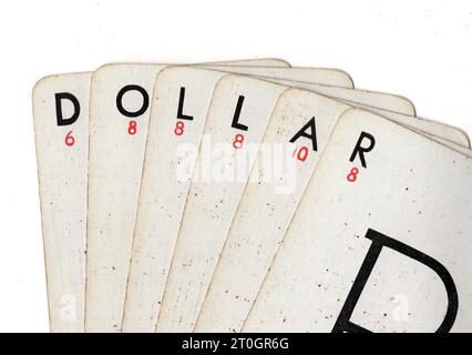 Vintage Lexicon playing cards spelling the word DOLLAR on a white background. Stock Photo