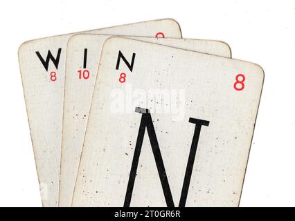 Vintage Lexicon playing cards spelling the word WIN on a white background. Stock Photo