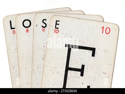 Vintage Lexicon playing cards spelling the word LOSE on a white background. Stock Photo