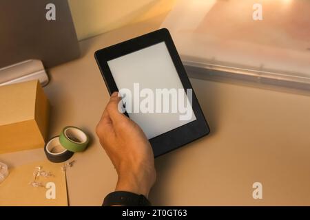 Reading E-book with Amazon paperwhite 3 Kindle stock photo Stock Photo