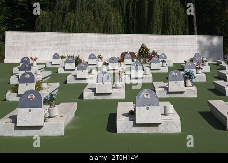 Tuzla, Bosnia and Herzegovina - Oct 4, 2023: This Slana Banja memorial complex remembers Tuzla residents killed or missing during the Bosnian War. Sun Stock Photo