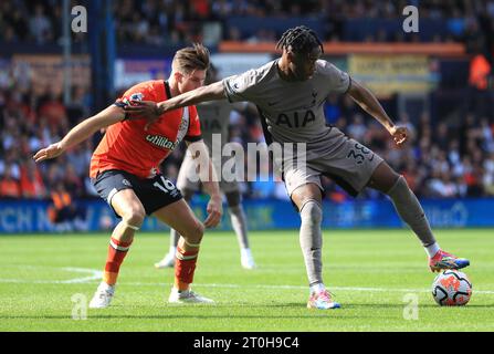 Luton Town's Reece Burke (left) and Tottenham Hotspur's Destiny Udogie battle for the ball during the Premier League match at Kenilworth Road, Luton. Picture date: Saturday October 7, 2023. Stock Photo