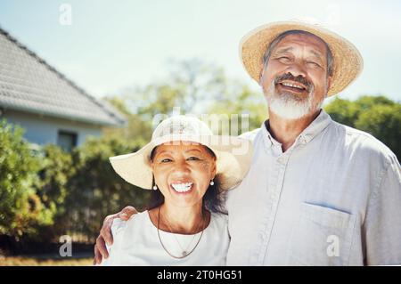 Happy, senior couple and portrait on farm, outdoor and home in countryside with happiness in countryside. Old people, farming and hug with smile for Stock Photo