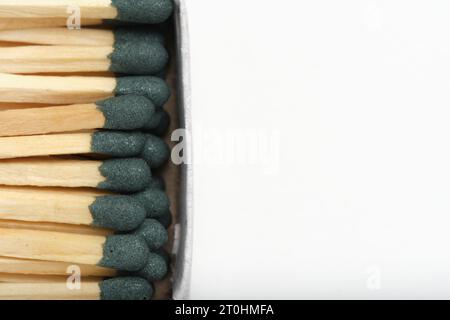 Matches with green head in box on white background Stock Photo