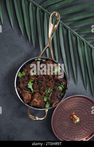 Sukha mutton or chicken, dry spicy Murgh or goat meat served hot,  mutton fry, special hot spicy traditional dish. Buffalo roast, meat pepper fry. Top Stock Photo