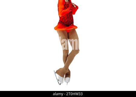 girl figure skater axel jump in bright red dress, figure skating single isolated on white background Stock Photo
