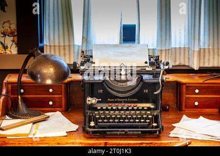 Antique Remington Typewriter on a wooden desk Stock Photo