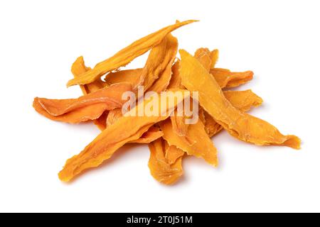 Heap of dried sweet mango chips close up isolated on white background Stock Photo