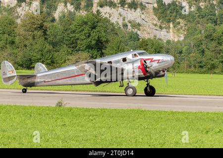 Mollis, Switzerland, August 18, 2023 NC-81125 Lockheed Model 12 Electra Junior aircraft is taxiing on the runway Stock Photo