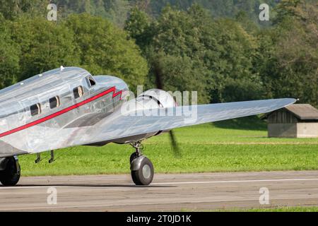 Mollis, Switzerland, August 18, 2023 NC-81125 Lockheed Model 12 Electra Junior aircraft is taxiing on the runway Stock Photo