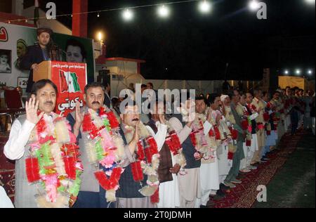 Pashtunkhwa Milli Awami Party (PKMAP) leader, Khushal Khan Kakar administrating oath as the newly elected members of Quetta District during oath taking ceremony held in Quetta on Saturday, October 7, 2023. Stock Photo