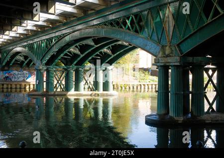 Railway bridge arches over the river Nene in Peterborough Stock Photo