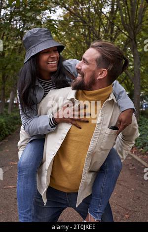 Lovely mixed race couple enjoying day out.  Stock Photo