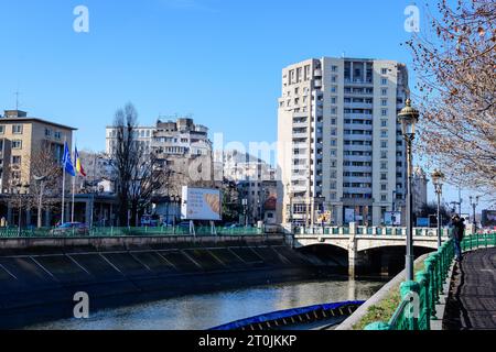 Bucharest, Romania, 2 January 2022: Modern buildings near Natiunile Unite Square (Piata Natiunile Unite) and bridge on Dambovita river and cloudy blue Stock Photo