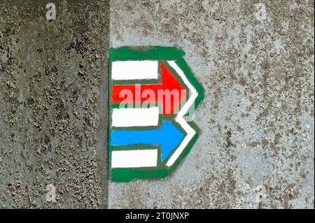 Tourist signs marks used in Czech republic. Red and blue arrows. Green and yellow marks are used for navigation on trails too. Direction concept. Stock Photo