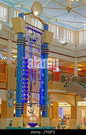 Kuwait City, Kuwait - July 13, 2018: Water clock tower in central hall of Souq Sharq shopping mall constructed by Professor Bernard Gitton. Stock Photo