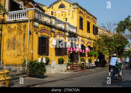 Hoi An, Vietnam. Street Scene with Cyclo Transport. Stock Photo