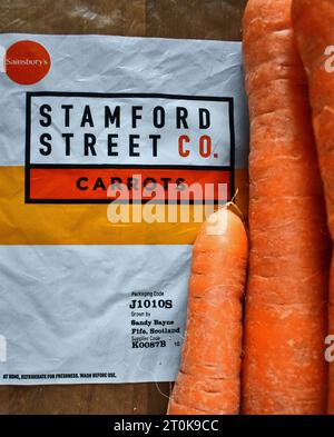Sainsbury's supermarket has moved its value brands, including fresh produce such as carrots, to a new label - Stamford Street Co. Stock Photo