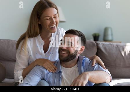 Cheerful attractive couple in love having fun at home Stock Photo
