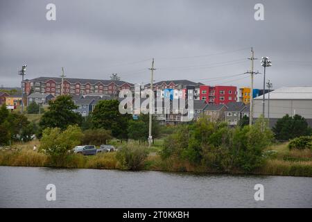 Colorful apartment buildings overlooking Quidi Vidi Lake in St. John's, Newfoundland & Labrador, Canada Stock Photo