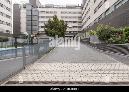 Community pool and children's play area in the interior patio of residential buildings Stock Photo