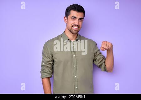 Young deaf mute man saying girlfriend using sign language on white background close up portrait isolated blue background Stock Photo