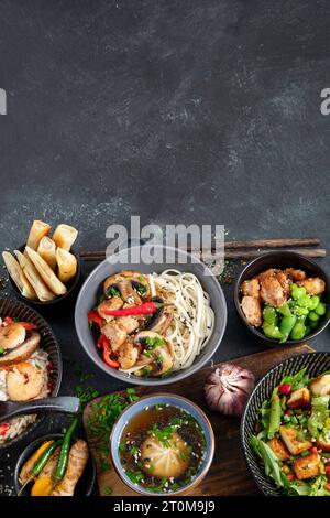Asian food background with various ingredients on a black background, top view. Copy space. Stock Photo