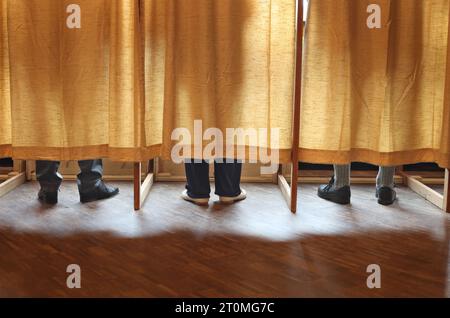 Schwangau, Germany. 08th Oct, 2023. Voters stand in a polling booth at a polling station. In Bavaria, the election for the 19th Bavarian state parliament takes place on Sunday. Credit: Karl-Josef Hildenbrand/dpa/Alamy Live News Stock Photo