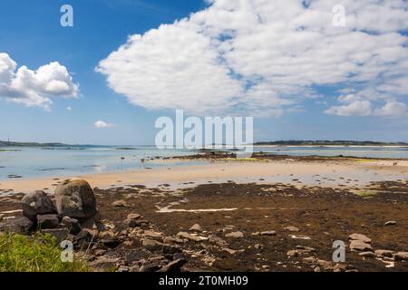 St. Martin's Flats at low tide, with the islands of Tresco and St. Mary's in the distance: Isles of Scilly, UK Stock Photo