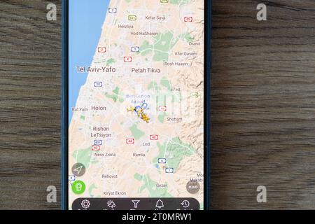 Batumi, Georgia - October 8, 2023: Close up of flights and air traffic over Israel on Flightradar24 app on mobile phone Stock Photo