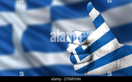 thumbs up in approval with the Greek flag painted Stock Photo