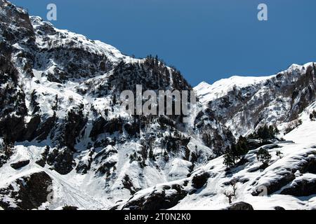 Kashmir Snow mountains. Nestled within the picturesque Kashmir valley, breathtaking sight, with the majestic snow-capped Himalayan mountains Stock Photo