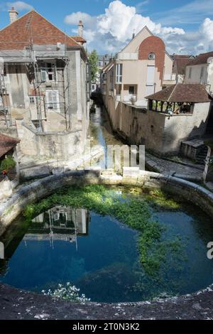 The Fosse Dionne in Tonnerre is a karst spring, fed by rainwater from the surrounding hills with its drainage channel to the Armançon River Stock Photo