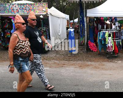 Live Oak, United States. 07th Oct, 2023. People wearing conehead costumes walk past vendor booths at the seventh annual Suwannee Roots Revival music festival, at the Spirit of the Suwannee Music Park in Live Oak, Florida. Credit: SOPA Images Limited/Alamy Live News Stock Photo