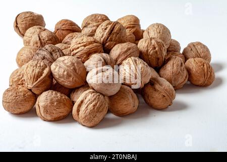 Loose nuts on white background Stock Photo