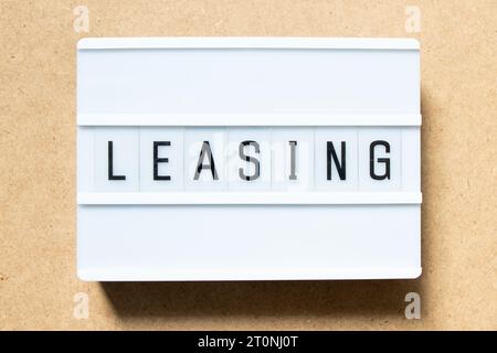 Lightbox with word leasing on wood background Stock Photo