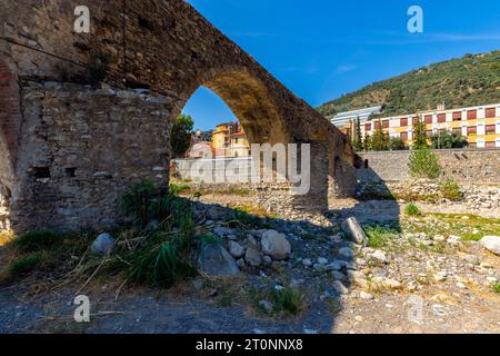 Ponte Antico, medieval village of  Taggia, Comune di Taggia, Liguria region of Italy. It is mistakenly called 'Roman', but in reality its oldest part, Stock Photo