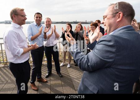 Scottish Labour leader Anas Sarwar (second left) welcomes newly elected MP for Rutherglen and Hamilton West Michael Shanks (far left) to the Labour Party conference in Liverpool. Picture date: Sunday October 8, 2023. Stock Photo