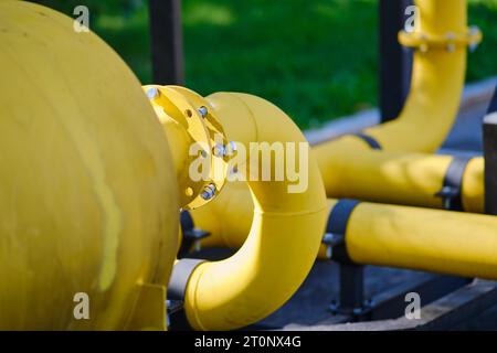 Fire extinguishing module with heat flow on gas pipes. Big yellow gas pipeline in the park, close-up of the pipe Stock Photo