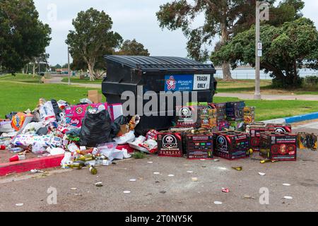 An accumulation of trash, broken wine bottles, and cases of illegal fireworks left behind after Independence Day (July 4th) holiday celebrations. Stock Photo