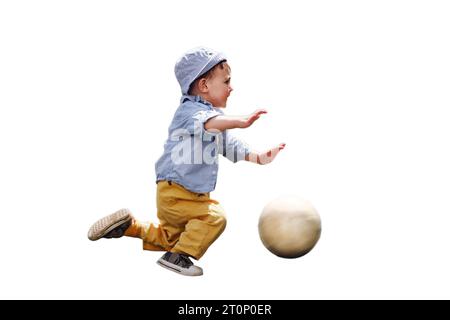 A child falls while playing with a ball on a football field, isolated on white background. Kid aged about two years (one year eleven months) Stock Photo