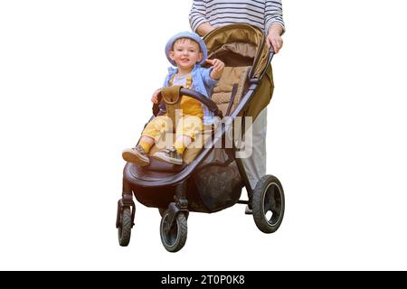 The woman and her baby son are enjoying the warm summer breeze while walking with their pushchair, isolated on white background. Kid aged about two ye Stock Photo