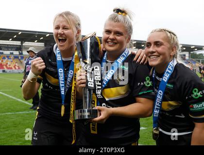 https://l450v.alamy.com/450v/2t0p3xg/york-valkyries-tara-jane-stanley-left-aimee-staveley-and-sinead-peach-right-celebrate-with-the-trophy-after-winning-the-betfred-womens-super-league-grand-final-match-at-the-lner-community-stadium-york-picture-date-sunday-october-8-2023-2t0p3xg.jpg