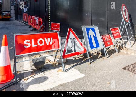 Traffic signs and cone at construction site, Millbank, City of Westminster, Greater London, England, United Kingdom Stock Photo