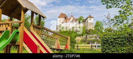 Playground and Castle of Burgdorf along the river Emme high on a hill entrance to Emmental, canton Bern in Switzerland Stock Photo