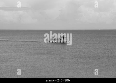 Poseidon Submarine boat mid tour in the ocean off Rhodes city departing from Mandraki Harbor in black and white Stock Photo