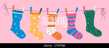 Socks with textures and patterns on a rope with colored clothespins. Vector illustration. Stock Vector