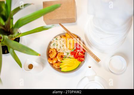 Poke bowl with shrimp on white background. Top view. High quality photo Stock Photo