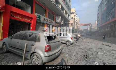 Gaza, Palestine. 8th Oct, 2023. (INT) Palestinians inspect the ruins of the Watan Tower, Palestine Tower, which were destroyed by Israeli air strikes in Gaza City. October 8, 2023. Gaza, Palestine: Palestinians inspect the ruins of the Watan Tower, Palestine Tower, which were destroyed by Israeli air strikes in Gaza City. Fighting raged between Israeli forces and the Palestinian Hamas movement on October 8, as Hundreds of people were killed on both sides after a surprise attack on Israel that prompted Prime Minister Benjamin Netanyahu to warn that they were ''embarking on a long and difficul Stock Photo